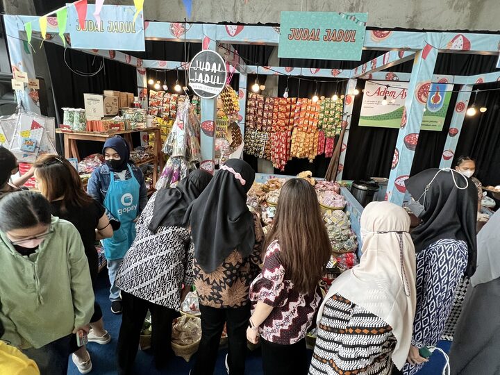 Shoppers browsing festival stalls