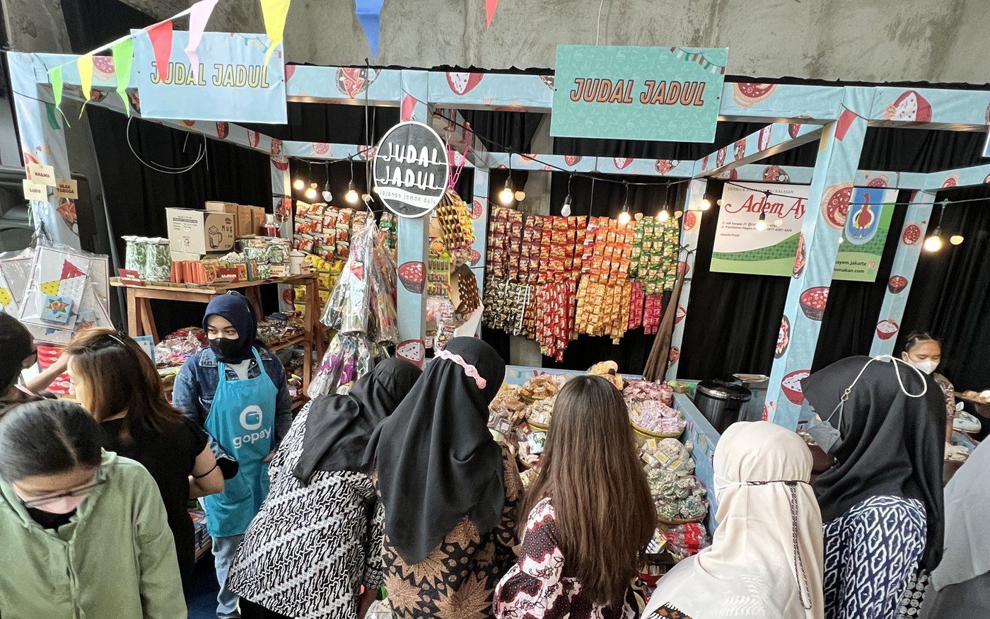 Shoppers crowding an affordable food bazaar